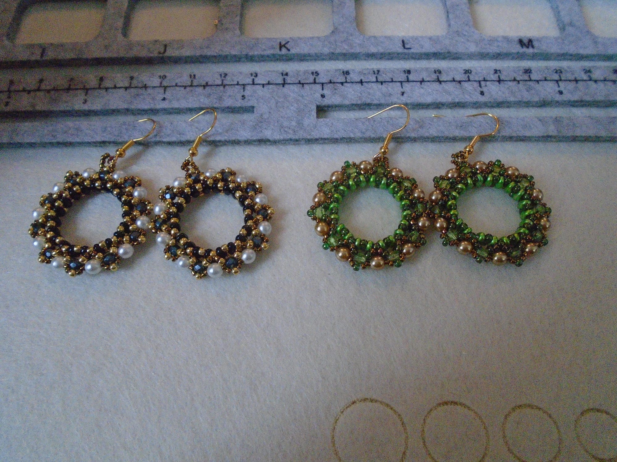 More wreath earrings. Left: black/white/gold. Right: green/gold/bronze.