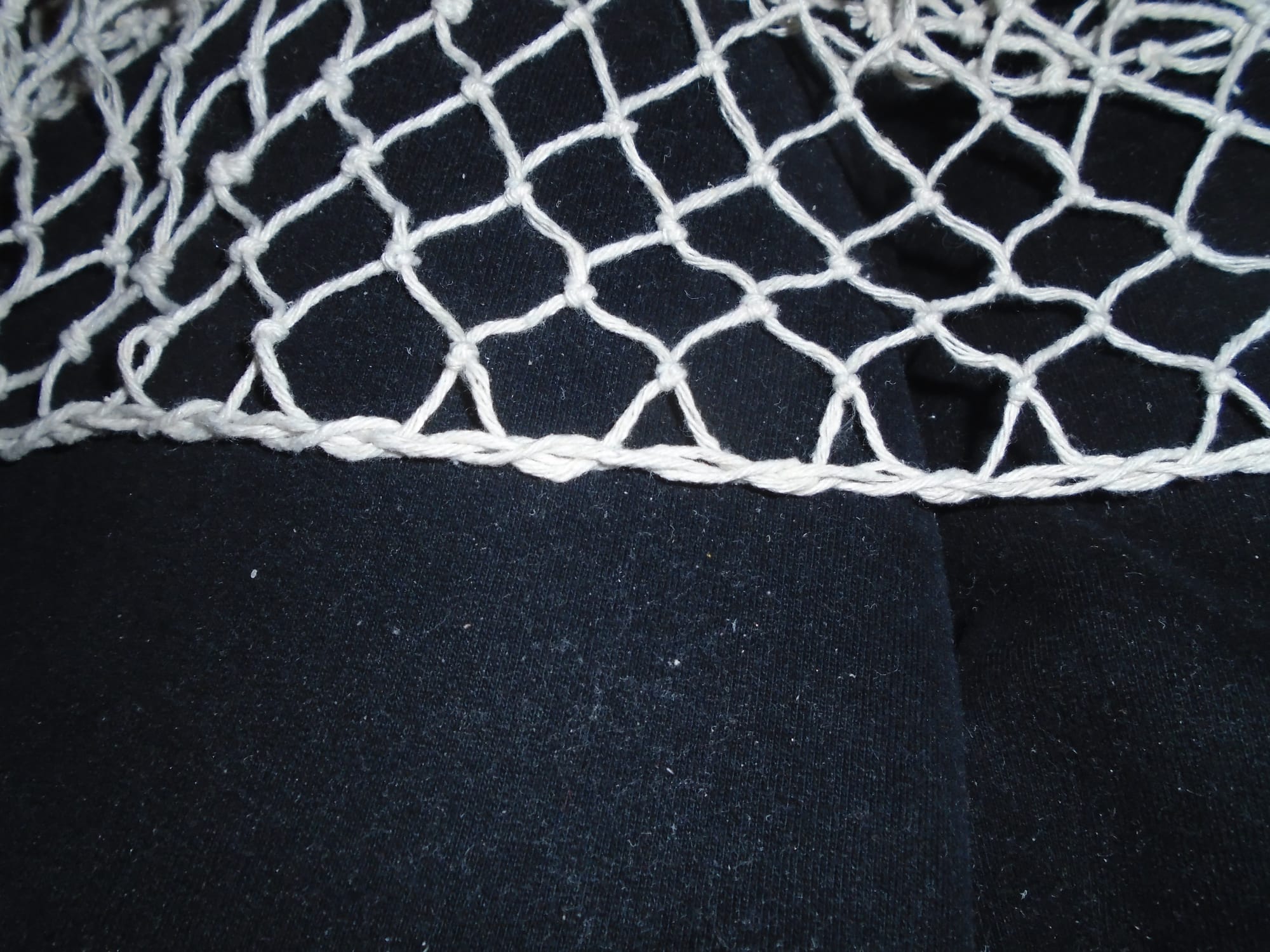 The technique has converted the edge from a row of diagonal loops to a neat straight edge.