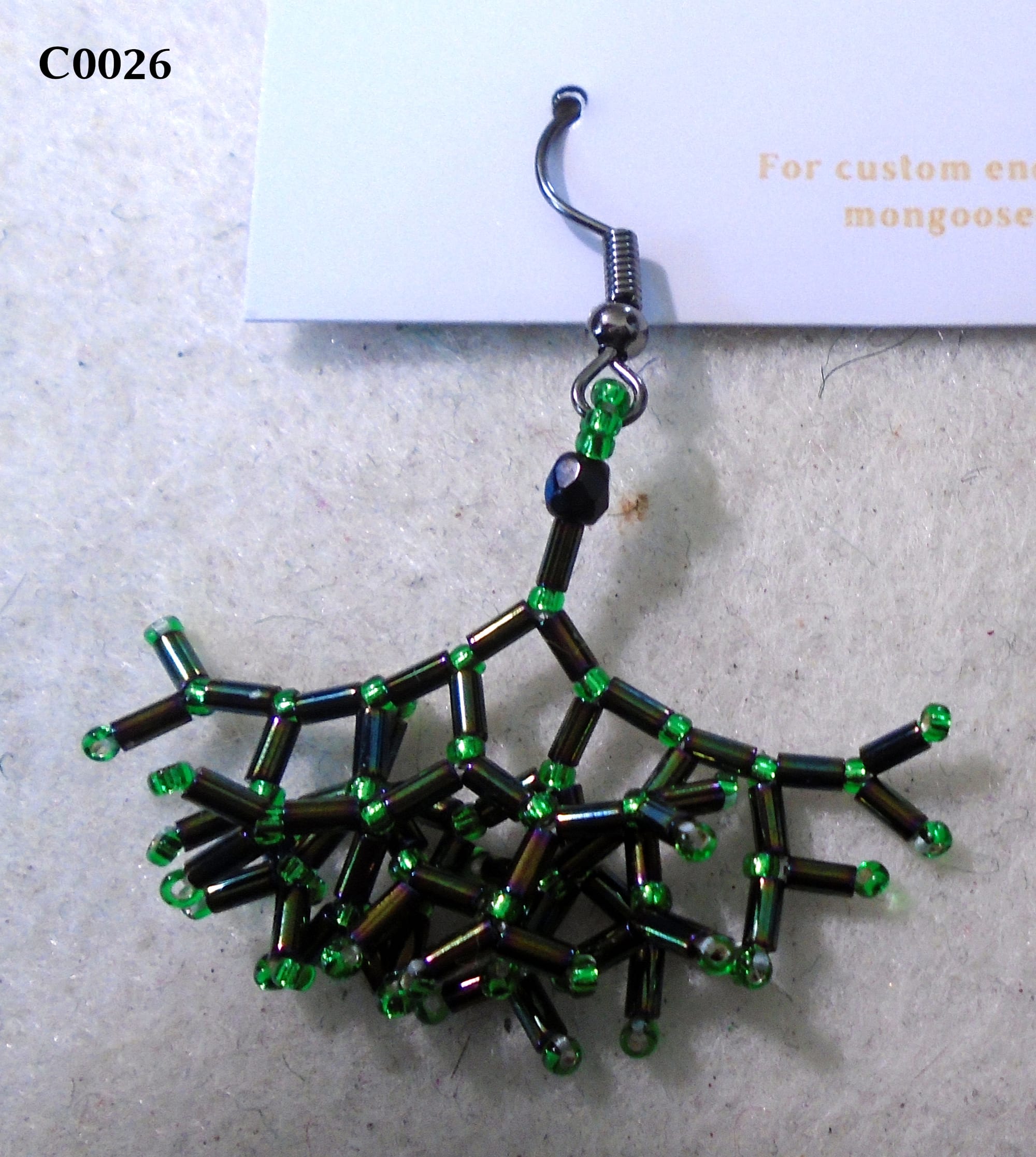 Fractal earring made with almost-black bugle beads and emerald green seed beads. Gunmetal earwire.