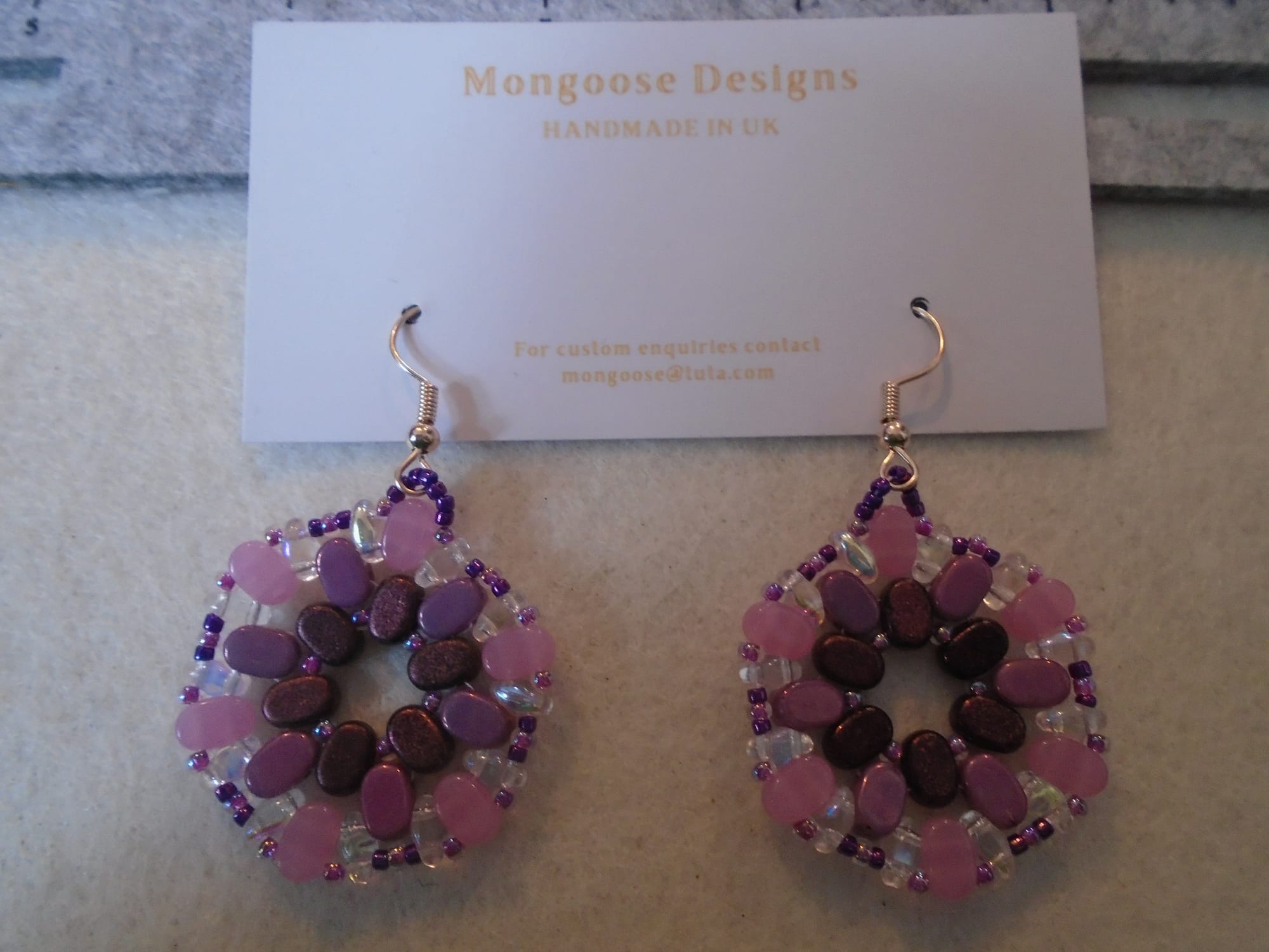 Hexagonal earrings toning from dark red-violet (centre) to rose pink (outside).  Rose gold earwires.