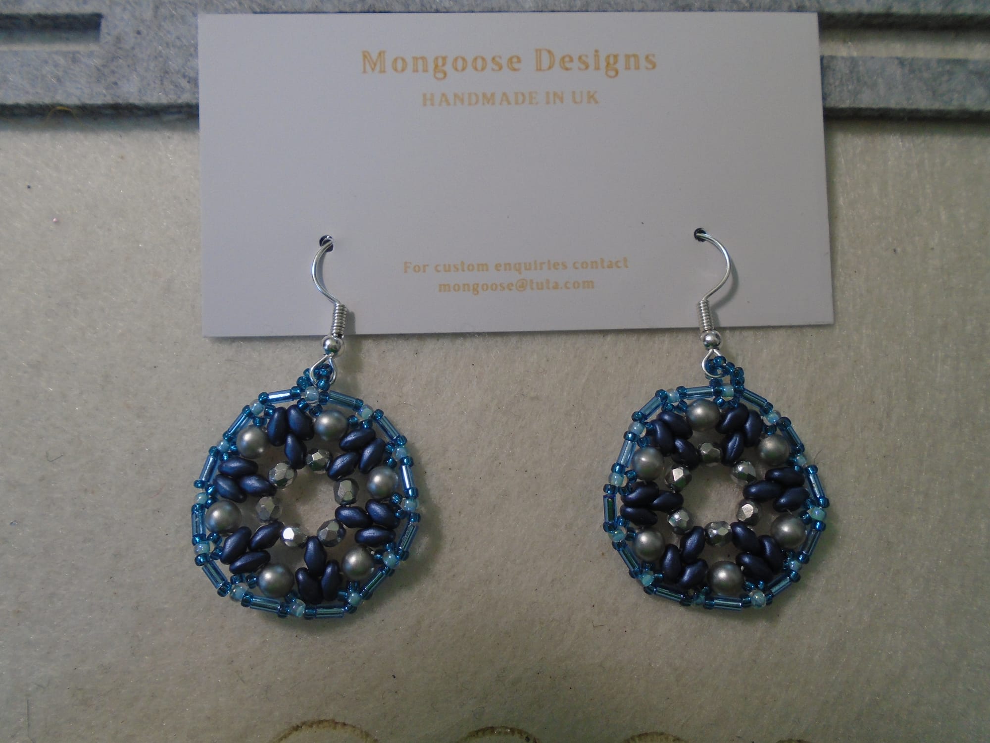 Another 1920s-style pair in blues and mid grey, with silver earwires.