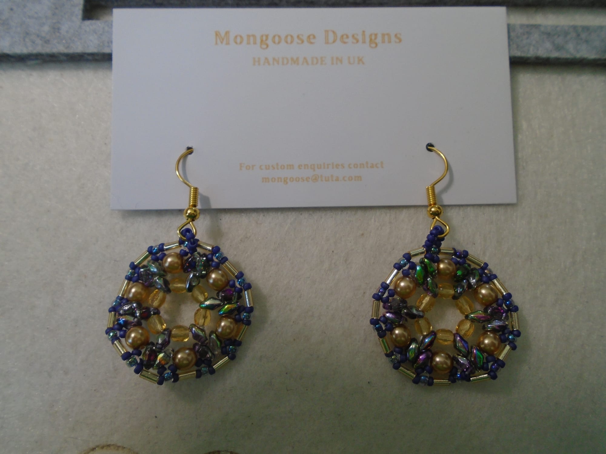 Again the 1920s style, this one mostly purple and gold with gold earwires.