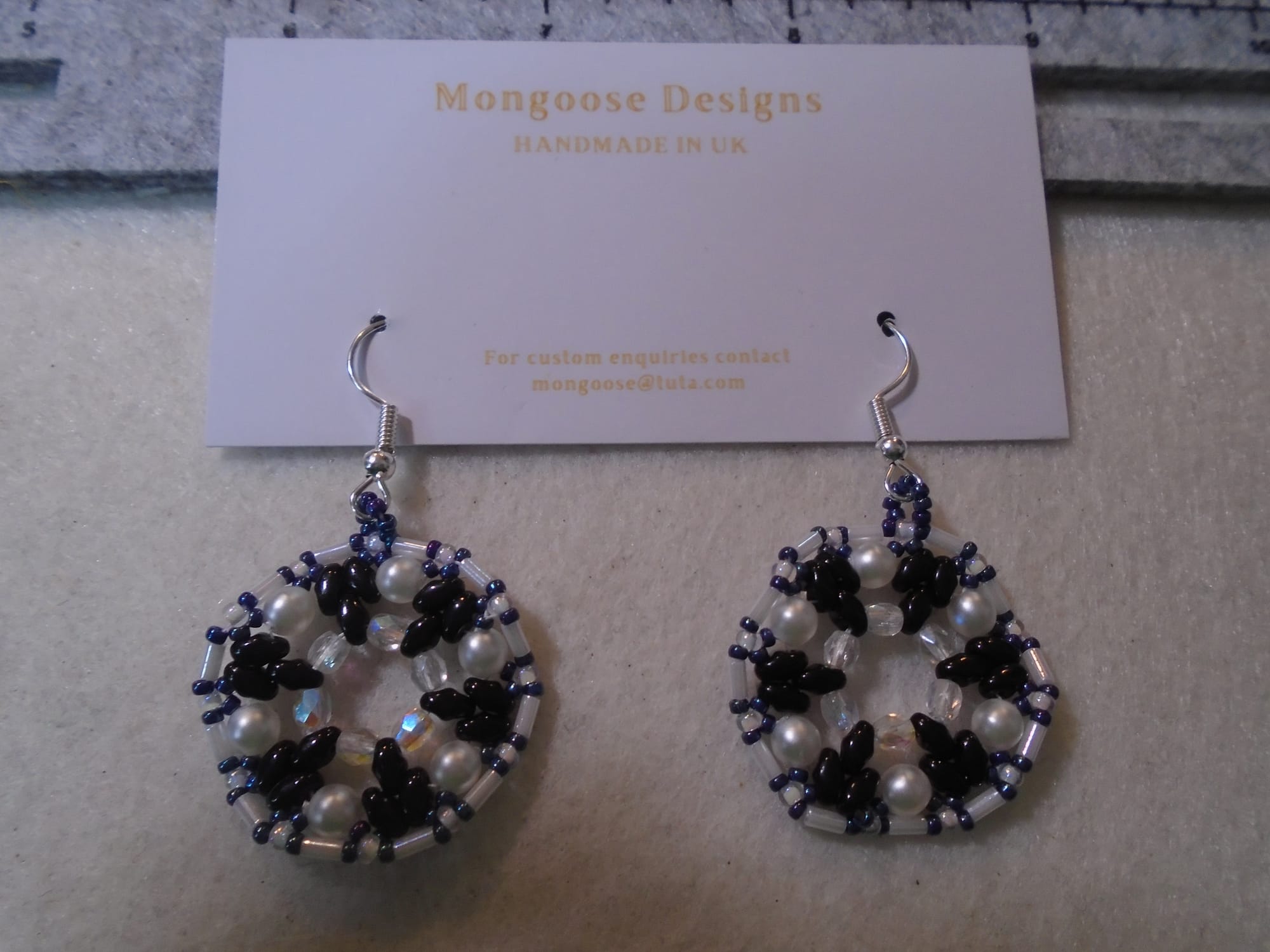 Almost black and white 1920s-style earrings on silver earwires.