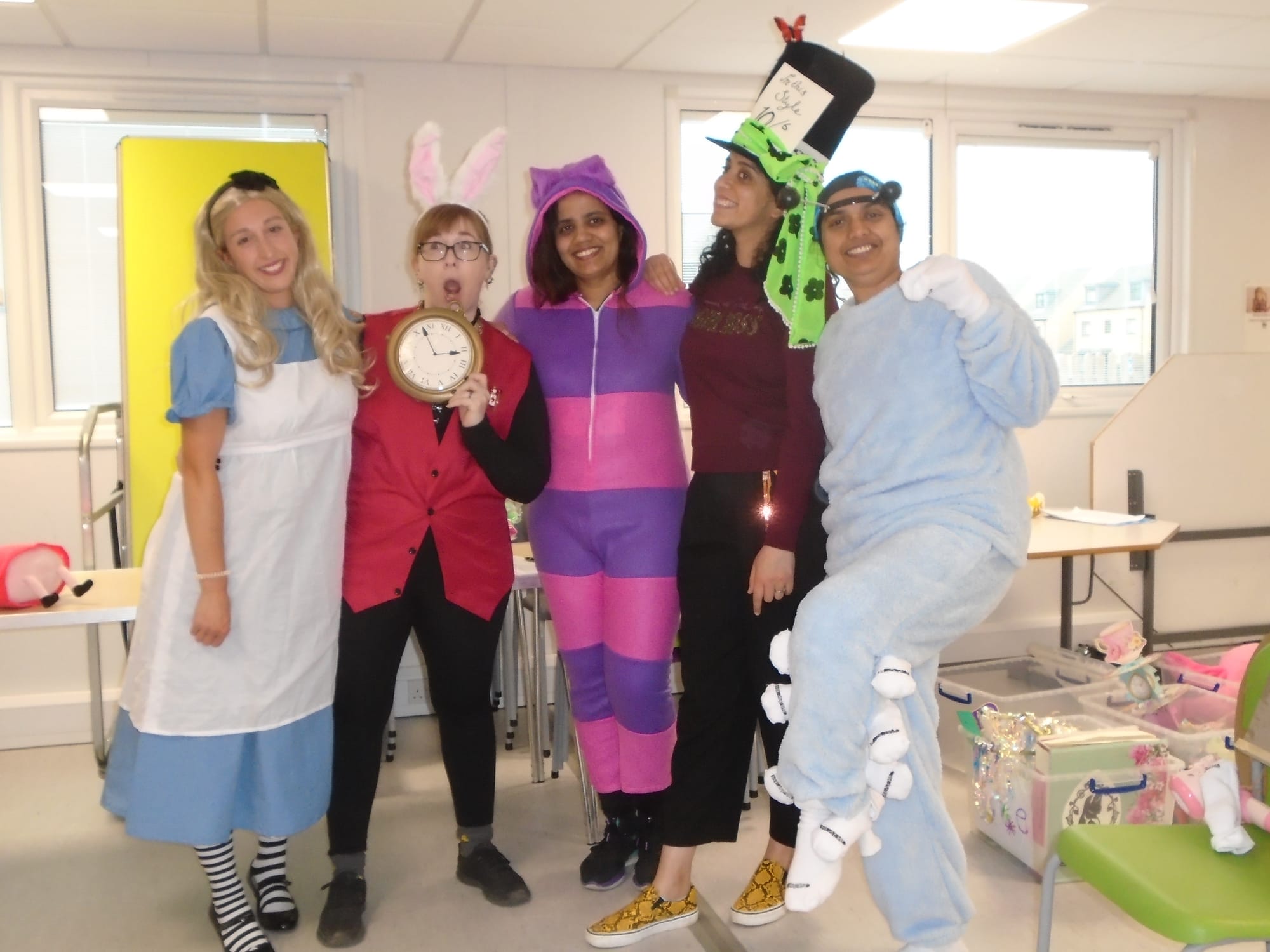 L to R: Alice, the White Rabbit, the Cheshire Cat, the Mad Hatter, and the Caterpillar.