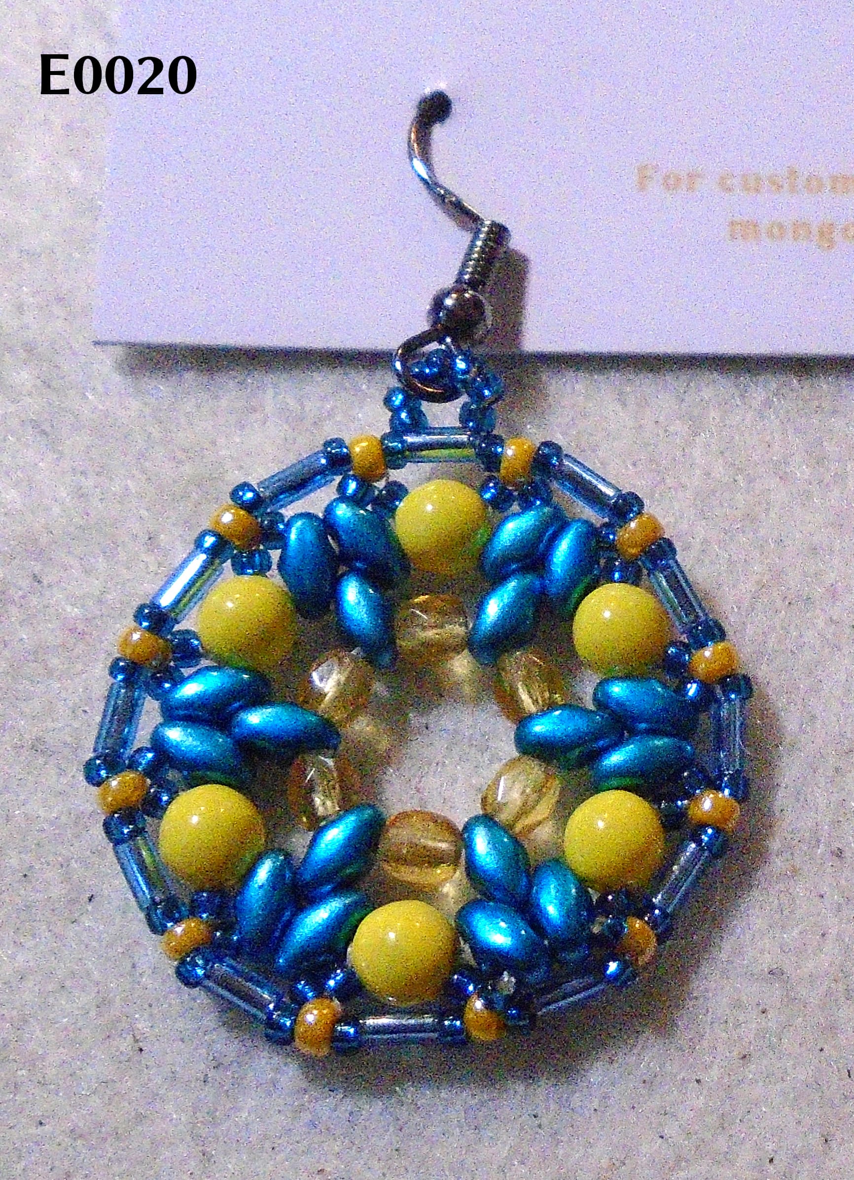 1920s-style earring: blue trefoils, bugles, and very small seeds; yellow everything else. Gunmetal earwire.