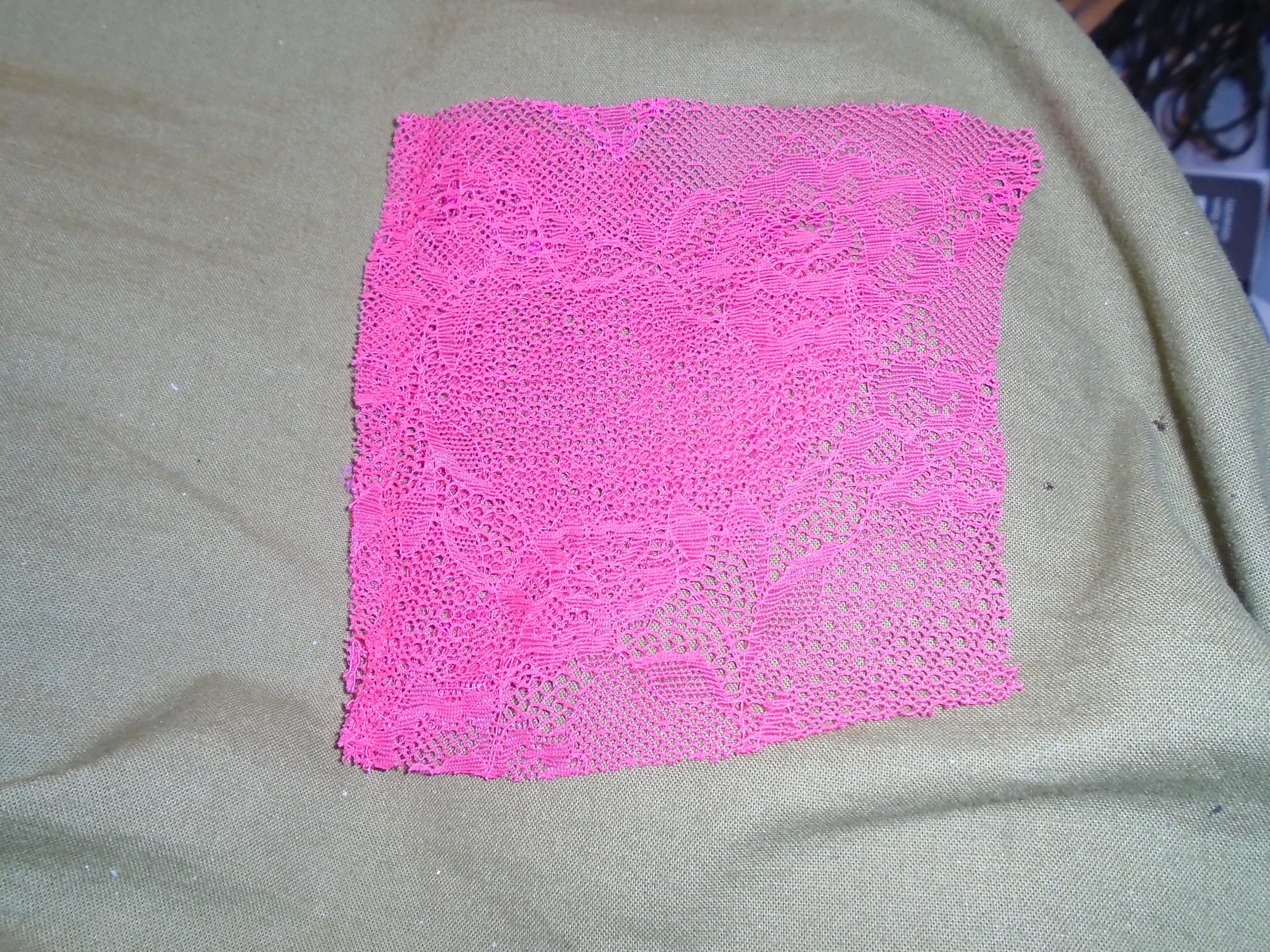 The lower panel is folded along the seam under the upper panel, which is almost square.