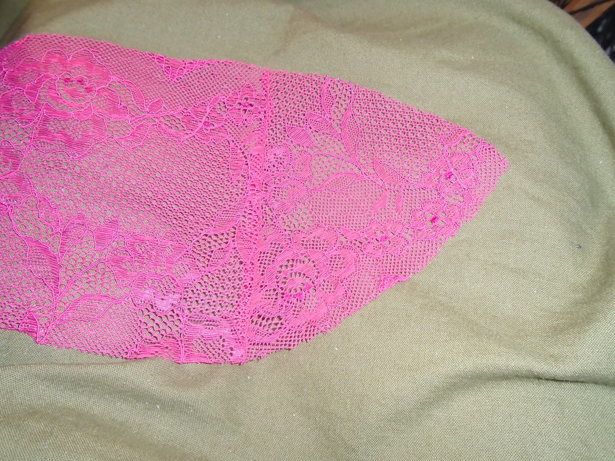 The lace has been unfolded along the seam, showing the shape of the upper panel.