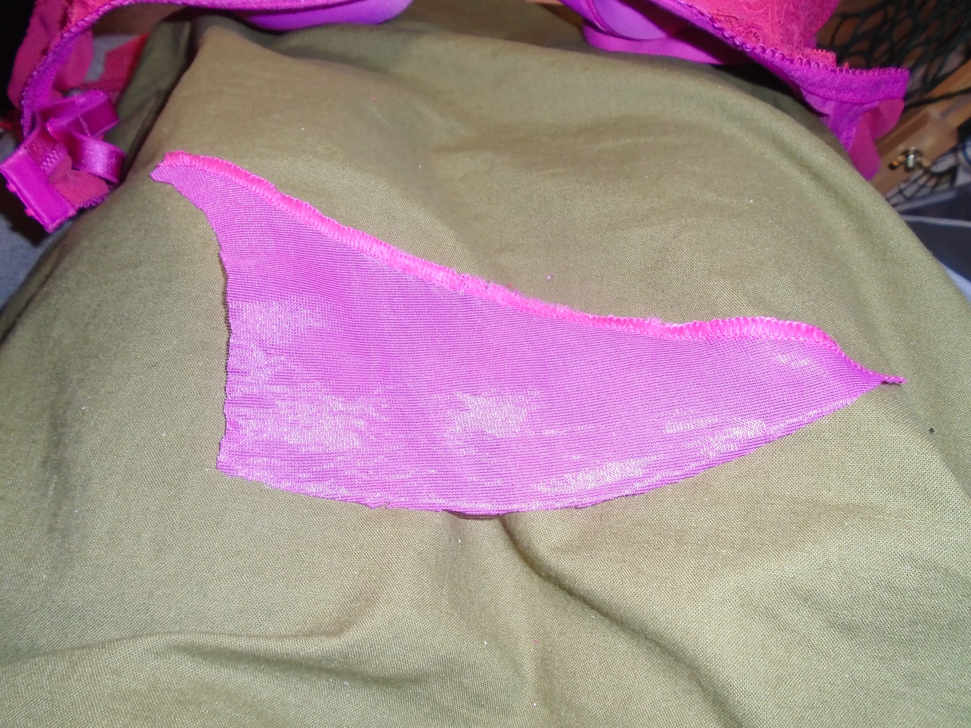 The piece is roughly triangular with a straight hypotenuse, the short side curved in, and the longer curved out.