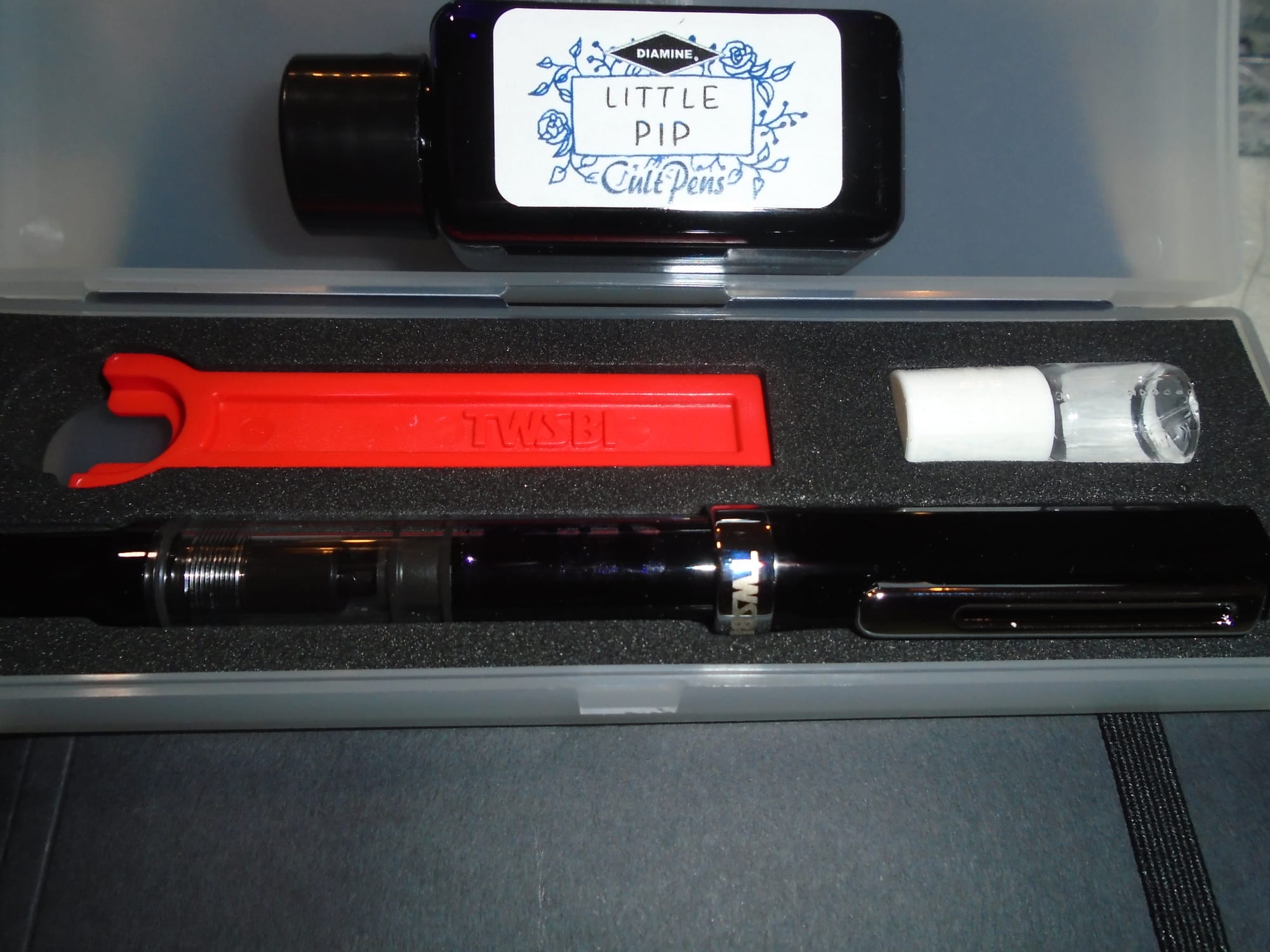 The ink bottle is quite small (my guess is 35 to 40 ml).  The silicone grease is a clear liquid in a dinky bottle.