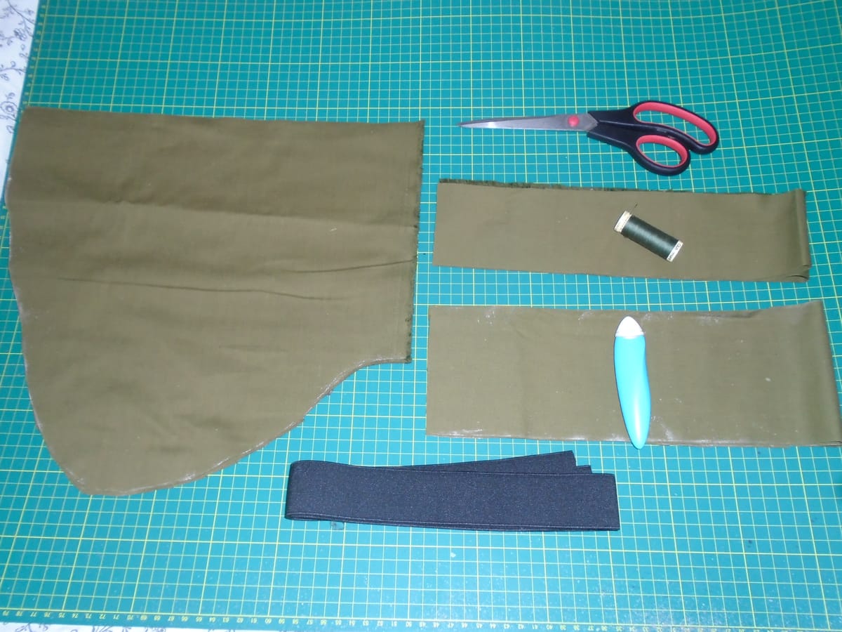 Pockets, waistband, and ties cut in olive green cotton, with the elastic, thread (a better match than it looks), and so on.