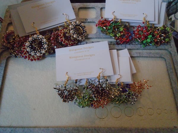 21 pairs of large bead earrings (7 each in 3 styles); predominantly red, green, and black/white at the moment.