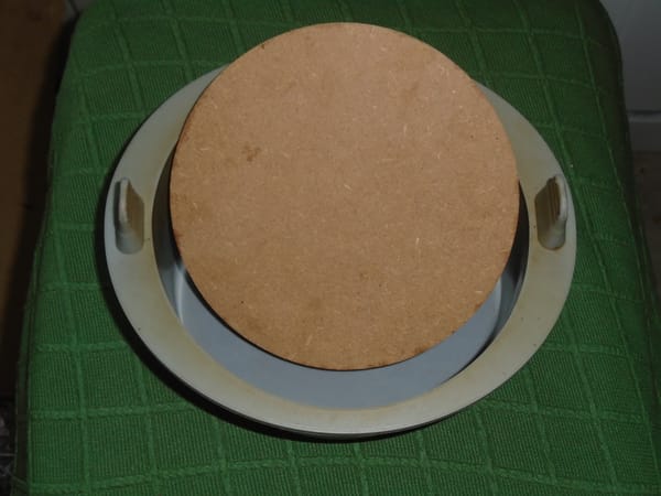 The disc is propped up inside a 15 cm (approx) silicone cake mould designed for the air fryer