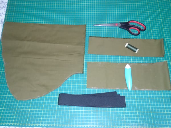 Pockets, waistband, and ties cut in olive green cotton, with the elastic, thread (a better match than it looks), and so on.