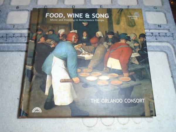 The cover of "Food, Wine, and Song" by the Orlando Consort, showing a mediaeval feast.  The CD is hidden behind.