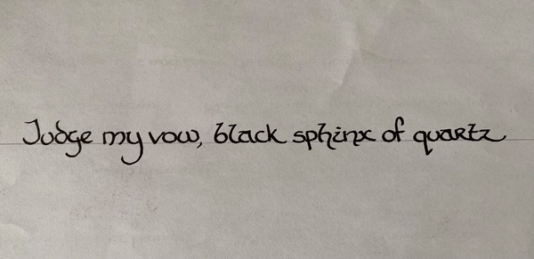 The text reads: "Judge my vow, black sphinx of quartz", which contains every letter of the alphabet.